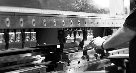 technician using sheet metal machine press