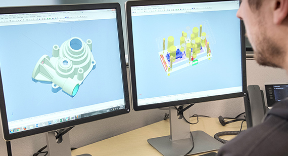application engineer examining injection molding CAD file
